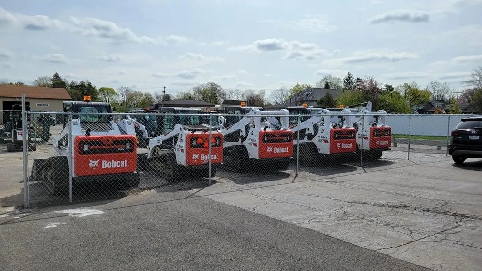Piranha Rents rental fleet of Bobcat machines lined up in the yard in Rochester NY